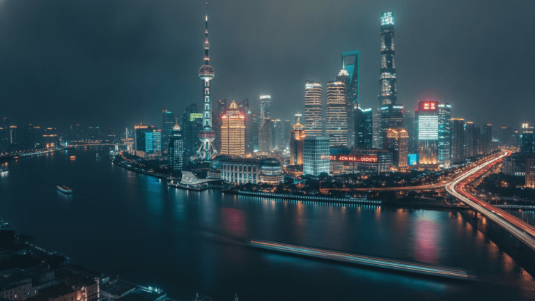 An ultra-wide elevated view of Shanghai's financial district at night. The river is dark with streaks of light from moving boats. The city is very well lit up in the background and the skyscrapers are very tall with different colors.