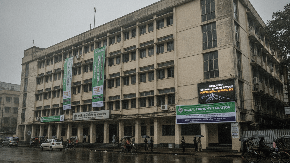 A wide shot of the beige National Board of Revenue building in Dhaka, Bangladesh, under overcast skies with rain. Two large green banners hang on the facade.